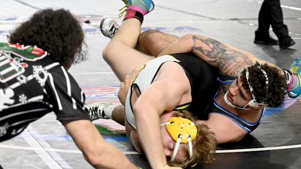 Sawyer Bartelt from South Dade works his way to a semifinals win against Kaleb Ivie from Merritt Island in a 215-pound match on Saturday at the Knockout Christmas Classic at Silver Spurs Arena in Kissimmee. 